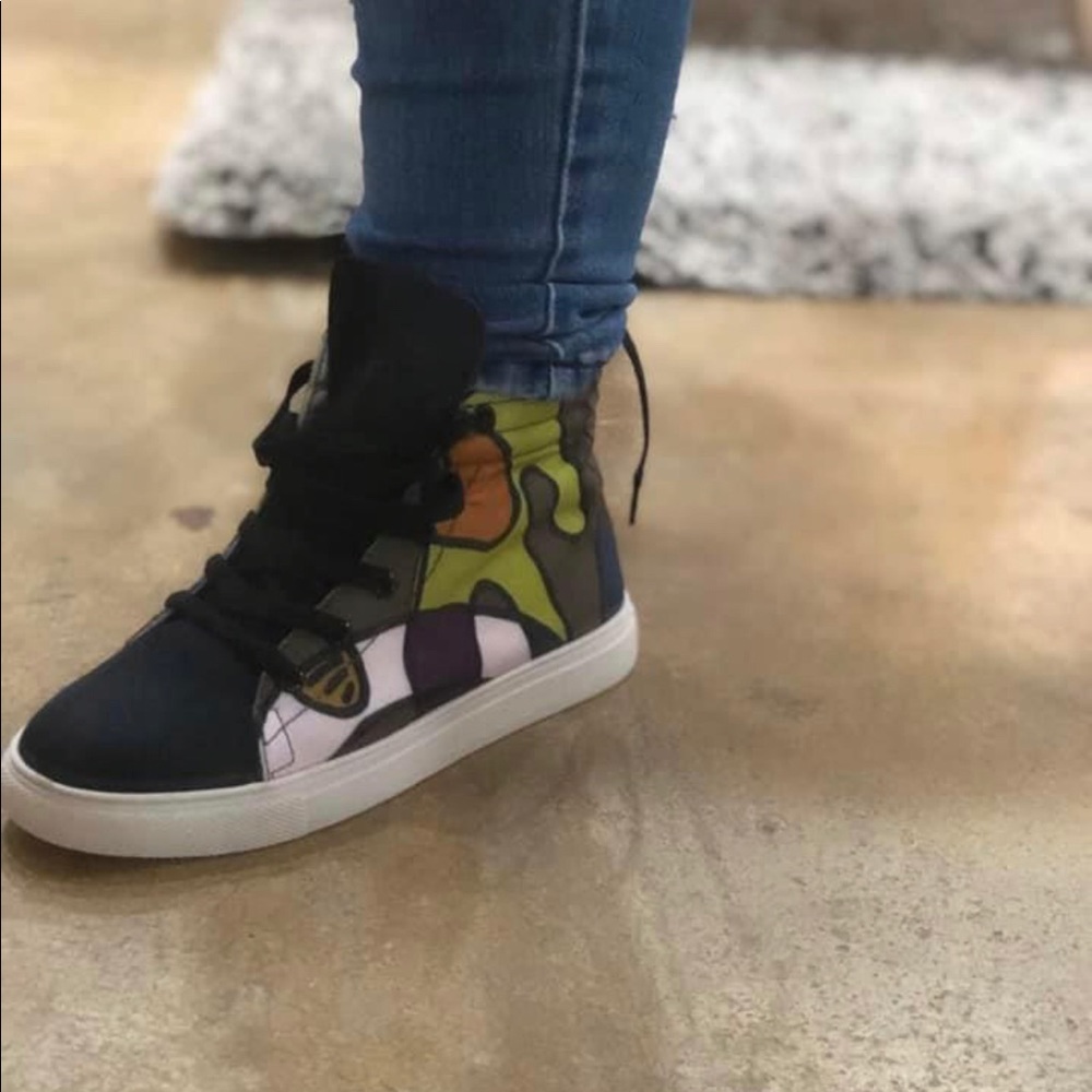 High top tennis shoe.